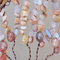 symphony of earthy sunstone strung on brown wire branches